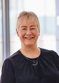 A head and shoulders image of Dr Jeanette Dickson wearing a black top.